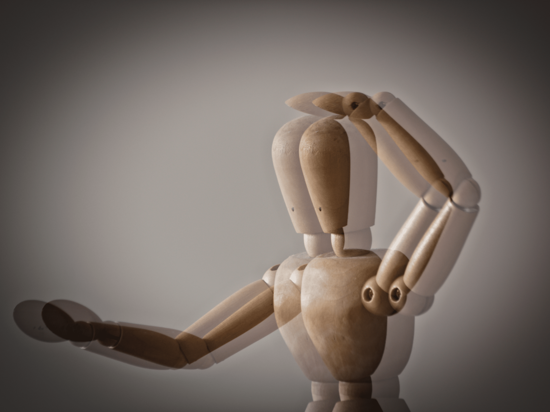 wooden body model that is blurry due to astigmatism