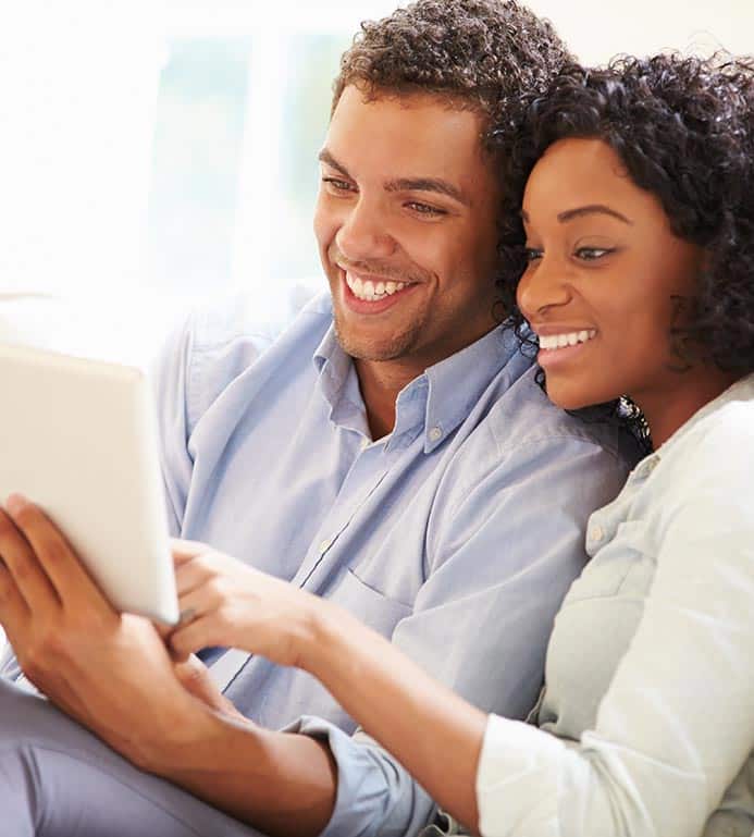 Couple Looking at a Tablet Computer